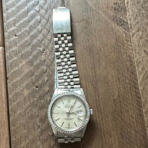 Men’s Stainless Rolex Datejust with custom gold diamond bezel.